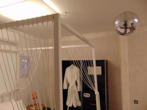 a room with a crib with a coat in it at AMO Folegandros in Karavostasi