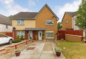 a house with a car parked in front of it at Silverburn new house with free parking and nice garden in Glasgow