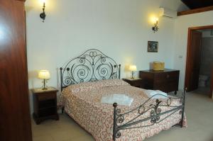 מיטה או מיטות בחדר ב-Agriturismo Masseria Quaremme