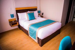 Cama ou camas em um quarto em Hotel Diamond Lima