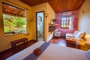 Cama ou camas em um quarto em Pousada Villa Lagoa das Cores