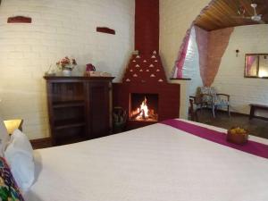 Cama ou camas em um quarto em Pousada Villa Lagoa das Cores