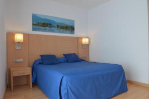 Postel nebo postele na pokoji v ubytování Hotel del Port
