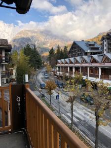 a view from a balcony of a town with a street at PETITE MAISON a 50 passi dalla funivia !!! in Courmayeur