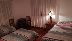 Letto o letti in una camera di Hostal Inti Wayra