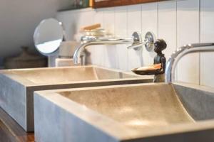 a sink in a kitchen with a faucet at Guest Room in Stuttgart-Nord in Stuttgart