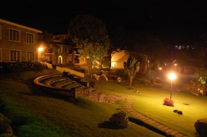 a park at night with a train in the yard at Green Pastures - A Hill Country Resort in Kodaikānāl