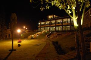 a building at night with a tree and a street light at Green Pastures - A Hill Country Resort in Kodaikānāl