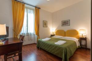 Postel nebo postele na pokoji v ubytování Hotel Rex
