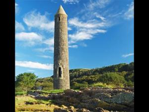 a tall stone tower sitting on top of a hill at 103 Nelson Street 1 st floor Right in Largs