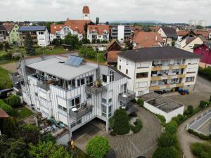 an aerial view of a building in a city at Ferienwohnungen Günther Hund in Immenstaad am Bodensee