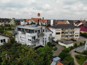 an aerial view of a building in a city at Ferienwohnungen Günther Hund in Immenstaad am Bodensee +19 photos