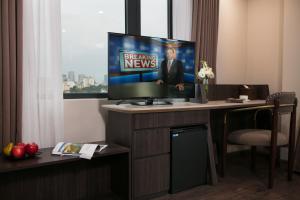 A television and/or entertainment center at Hanoi L'Heritage Diamond Hotel & Spa