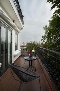 A balcony or terrace at Hanoi L'Heritage Diamond Hotel & Spa