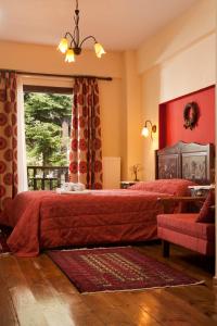 a bedroom with two beds and a window at Fretzato in Elati Trikalon