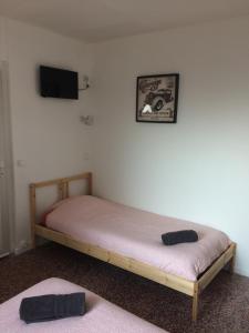 Postel nebo postele na pokoji v ubytování Relais Maximilien