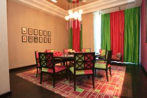 a dining room with a table and chairs at Yas Island Rotana Abu Dhabi in Abu Dhabi