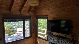 TV a/nebo společenská místnost v ubytování Pendientes de Moquehue