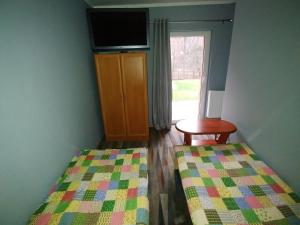 Łóżko lub łóżka w pokoju w obiekcie Noclegi pod Klimczokiem