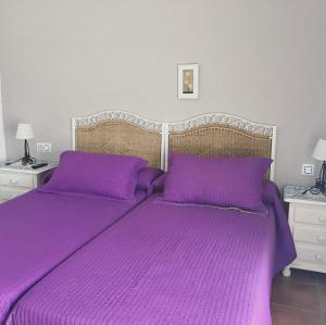 מיטה או מיטות בחדר ב-Hostal El Espinel