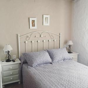 Ένα ή περισσότερα κρεβάτια σε δωμάτιο στο Hostal El Espinel