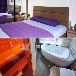 a bedroom with a bed and a bath tub at Sauna, Big Jacuzzi , Khreshchatyk apartments in Kyiv