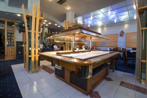 a kitchen with a large island in a restaurant at Hotel Kristal in Jahorina