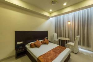 Кровать или кровати в номере Hotel Sri Kamal International