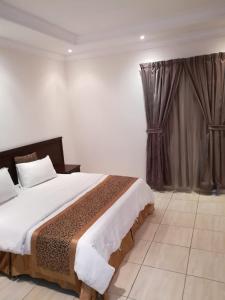 Postel nebo postele na pokoji v ubytování Leen Serviced Apartments