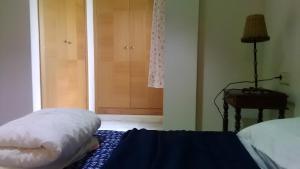 Apartamento en el centro de Huelvaにあるベッド