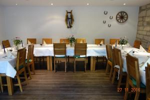 a large dining room with a long table and chairs at Gasthof Postkutsche in Motten