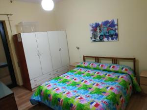 A bed or beds in a room at Casa Ferrara