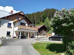 a house with a car parked in front of it at Appartement Großwallner in Radstadt