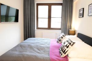 Posteľ alebo postele v izbe v ubytovaní Apartamenty Kora
