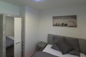 Postel nebo postele na pokoji v ubytování Muhusin Apartments