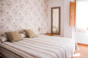 Postel nebo postele na pokoji v ubytování Hostal El Pozo