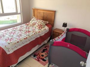 En eller flere senge i et værelse på Precioso departamento en Papudo + 14 billeder