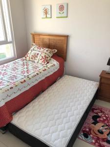 En eller flere senge i et værelse på Precioso departamento en Papudo