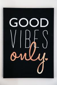 a sign that reads good vibes only at Airport Hotel Sydney (Formerly Comfort Hotel Sydney Airport) in Sydney