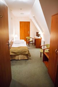 Posteľ alebo postele v izbe v ubytovaní Hotel Logos + 37 fotografií