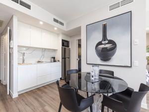A kitchen or kitchenette at Sleek, modern and comfortable on Hastings Street
