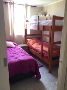 En eller flere senge i et værelse på Laguna Bahía Algarrobo edificio Océano 406