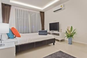 TV a/nebo společenská místnost v ubytování DREAMNEST Studio in Laguna Beach Resort - Maldives