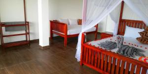 a living room with two beds and a couch at Divine View Homestay in Ella
