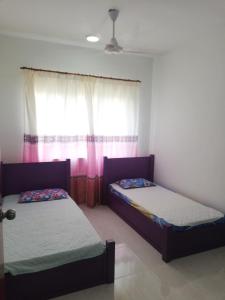 Een bed of bedden in een kamer bij MZ Homestay KT