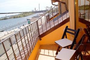 a balcony with a table and chairs and the ocean at Vila Maritimo in Mangalia +26 photos