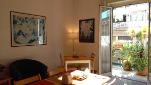 a dining room with a table and a table and a window at Ariston Petit Hotel in Palermo