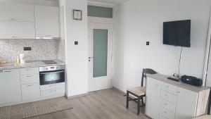 A kitchen or kitchenette at Roza Apartment