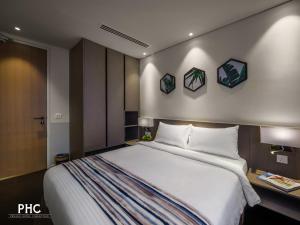 Postel nebo postele na pokoji v ubytování Ropewalk Piazza Hotel Managed by The Ascott Limited