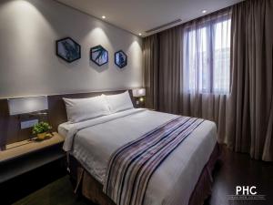 Postel nebo postele na pokoji v ubytování Ropewalk Piazza Hotel Managed by The Ascott Limited